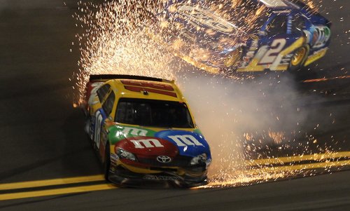 Kyle Busch fights for control of his car after contact with another driver during last year's Bud Shootout.  Busch would survive two such incidents and come back to nip Tony Stewart at the line for the victory.  This year, the event will become The Sprint Unlimited At Daytona.  Photo by Matthew Stockman/Getty Images