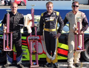 D.J. Shaw (center) held off Tyler Church (left) and Preston Peltier (right) to score the win in the Easter Bunny 150 for the PASS South Series at Hickory Motor Speedway.  Photo by Laura / LWpictures.com