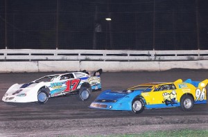 Chris Holley (17) drives around the outside of Billy Gould (96) en route to his tenth NeSmith Chevrolet Weekly Racing Series Late Model win of the season on Saturday night at Battleground Speedway in Highlands, TX.  Photo by Ron Skinner