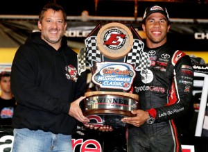 Tony Stewart presents Darrell Wallace, Jr. with the trophy after winning the Camping World Truck Series Mudsummer Classic at Eldora Speedway Wednesday night.  Photo by Sean Gardner/NASCAR via Getty Images