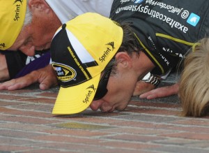 Jeff Gordon kisses the bricks on the start-finish line at the Indianapolis Motor Speedway after winning a record fifth Brickyard 400 in Sunday's NASCAR Sprint Cup Series race.  Photo by Rainier Ehrhardt/NASCAR via Getty Images