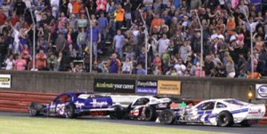 Tim Brown (83) tangled with Burt Myers (1) during Saturday night's Modified feature at Bowman Gray Stadium.  Photo by Eric Hylton Photography