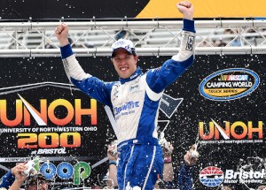 Brad Keselowski celebrates in victory lane after winning his first NASCAR Camping World Truck Series race in the rain delayed event Thursday morning at Bristol Motor Speedway. Photo by Patrick Smith/NASCAR via Getty Images