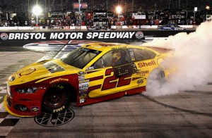 Joey Logano celebrates with a burnout after winning Saturday night's NASCAR Sprint Cup Series race at Bristol Motor Speedway.  Photo by Patrick Smith/Getty Images