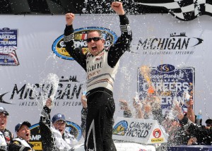 Johnny Sauter celebrates in Victory Lane after winning Saturday's NASCAR Camping World Truck Series race at Michigan International Speedway. Photo by Will Schneekloth/NASCAR via Getty Images
