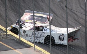Matthew Wragg (29) and Jason Bates (22) come to rest against the outside wall after tangling during Saturday night's Outlaw Late Model feature at Gresham Motorsports Park.  Both drivers, along with members of their teams, have been suspended from racing in the August 16 event at the track.  Photo by Fred Simmons