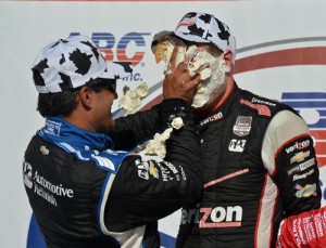 Will Power takes a cream puff to the face from Juan Pablo Montoya in Victory Lane after winning Sunday's ABC Supply Wisconsin 250 at the Milwaukee Mile. Photo by Chris Owens