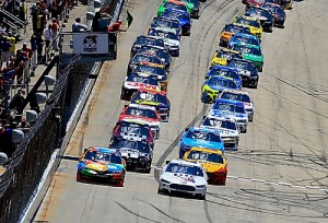 Brad Keselowski (2) and Kyle Busch (18) lead the field to the green flag to start June's NASCAR Sprint Cup Series race at Dover International Speedway.  Photo by Rob Carr/Getty Images