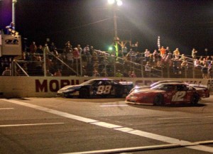 Daniel Hemric (98) edges Augie Grill (112) and Jeff Choquette (29) as the three raced three wide to the checkered flag for the win in Saturday night's Southern Super Series season finale at Mobile International Speedway.  Photo by Matthew Bishop