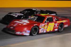 R.A. Brown (60) makes the pass for the lead on Randy Porter (32) en route to the victory in Friday night's Late Model Stock portion of the Rupert Porter Memorial at Anderson Motor Speedway.  Photo by Christy Kelley