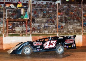 Tom Maddox waves to the crowd as he sweeps under the checkered flag to score the Super Late Model victory at Rome Speedway Sunday night.  Photo by Kevin Prater/praterphoto.com