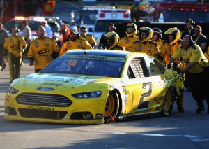 Brad Keselowski is pushed to the garage area for repairs after suffering a mechanical failure during Sunday's NASCAR Sprint Cup Series race at Martinsville Speedway.  Photo by Jonathan Moore/Getty Images