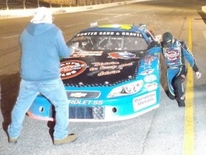Cole Williams is sprayed by champagne by Fairgrounds Speedway Nashville promoter Tony Formosa after Williams wrapped up the 2014 Pro Late Model track championship.  Photo by Steve Brown