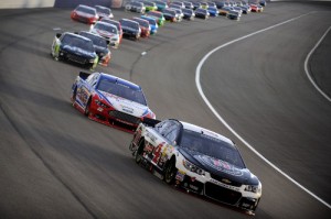 Kevin Harvick leads a pack of cars during May's NASCAR Sprint Cup Series race at Kansas Speedway.  Photo by Will Schneekloth/NASCAR via Getty Images