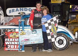 Austin Sanders in joined by Joy Reutimann in victory lane after scoring the Emil and Dale Reutimann Memorial for the Gagel's Open Wheel Modifieds Saturday night at East Bay Raceway Park.  Photo courtesy EBRP Media