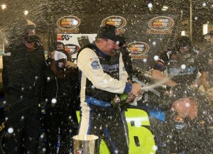 Greg Pursley celebrates his second NASCAR K&N Pro Series West championship with his teammates Thursday night at Phoenix International Raceway.  Photo by Getty Images for NASCAR