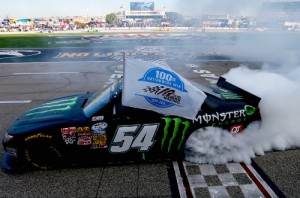 Kyle Busch celebrates with a burnout after winning Saturday's NASCAR Nationwide Series race at Texas Motor Speedway.  Photo by Sean Gardner/NASCAR via Getty Images