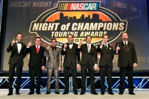 NASCAR champions (L-R) Anthony Kumpen, Andy Seuss, Abraham Calderon, L.P. Dumoulin, Doug Coby, Ben Rhodes and Greg Pursley pose for a group photo during the NASCAR Night Of Champions Touring Awards ceremony at the Charlotte Convention Center Saturday night.  Photo by Grant Halverson/NASCAR via Getty Images