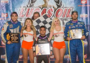 Rico Abreu (center) outdueled the competition to score the A-Feature victory in Wednesday's Chili Bowl Nationals qualifier.  Chris Windom (left) finished in second, with J.J. Yeley (right) in third.  Photo by Pat Grant