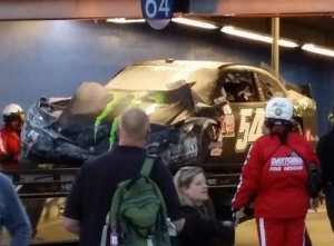 Kyle Busch's damaged car is taken back to the garage area.  Busch was injured in a late race crash during Saturday's NASCAR Xfinity series race at Daytona.  Photo by Christopher Fouche