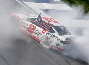 Brad Keselowski celebrates with a burnout after winning Sunday's NASCAR Sprint Cup Series race at Auto Club Speedway.  Keselowski made a late race pass on Kurt Busch to score the win.  Photo by Todd Warshaw/NASCAR via Getty Images