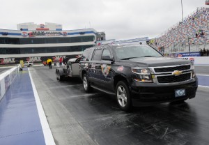 Track crews try to dry the track at zMax Dragway in Charlotte, NC.  The wet weather eventually led to the cancellation of Friday's qualifying for the NHRA Four-Wide Nationals.  Photo courtesy NHRA Media