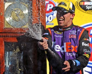 Denny Hamlin celebrates in Victory Lane after winning Sunday's NASCAR Sprint Cup Series race at Martinsville Speedway.  Photo by Rainier Ehrhardt/NASCAR via Getty Images