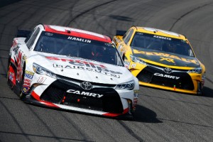 Denny Hamlin (11) leads teammate Matt Kenseth (20) during Sunday's NASCAR Sprint Cup Series race at Auto Club Speedway.  Photo by Doug Pensinger/NASCAR via Getty Images