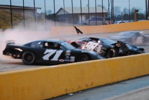 Jody Measamer (98) and Jimmy Doyle (71) tangled coming off turn four with three laps to go, leaving both cars damaged.  Photo by Christy Kelley