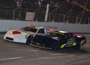 Payton Ryan (23) battles with Matt Piercy (25) during Saturday night's Late Model feature at Hickory Motor Speedway.  Ryan would go on to score the victory.  Photo by Sherri Stearns