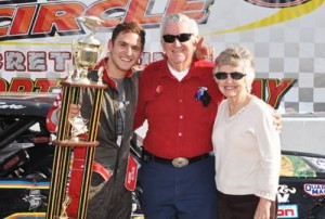 Judy Allison (right) celebrates in victory lane with her grandson Robbie (left) and her husband Bobby (left) at Kingsport Speedway after Robbie scored the win in his Pure Street division debut. Judy passed away Friday following complications from surgery. Photo by Randall Perry