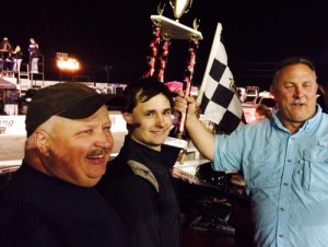 Donald Crocker (center) scored the victory in the inaugural Modifieds of Mayhem Tour feature at Mobile International Speedway Saturday night.  Photo courtesy MIS Media