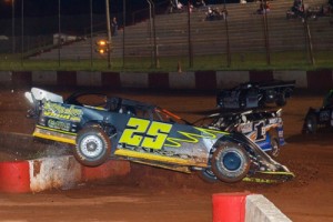 Matt Larson's racer gets airborne after contact with the inside pit wall in turn one during Saturday night's Steel Head Late Model feature.  Photo by Kevin Prater/praterphoto.com