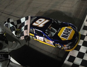 Brandon McReynolds takes the checkered flag Saturday night to win the combined NASCAR K&N Pro Series East and West race at Iowa Speedway. Photo by Jonathan Moore/Getty Images for NASCAR