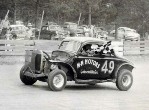 Georgia Racing Hall of Famer Bud Lunsford on the backstretch at Banks County Speedway during a victory lap.  The win came during the track's first year of operation in 1956.  Photo courtesy Mike Bell