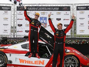 Dane Cameron and Eric Curran celebrate in victory lane after scoring the TUDOR United Sports Car Championship DP victory at Detroit on Saturday.  Photo by Michael L. Levitt LAT Photo USA