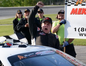 Joey Doiron celebrates after winning Sunday's PASS North Super Late Model race at Thunder Road.  Photo by Norm Marx