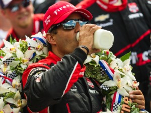 Juan Pablo Montoya drinks the traditional milk in victory lane after winning Sunday's Indianapolis 500.  Photo by Jason Porter