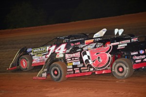 Ronnie Johnson (5) battles for the lead with 12-year-old Tyler Clem (14) during Saturday night's NeSmith Chevrolet Dirt Late Model Series feature at Talladega Short Track.  Johnson went on to score the victory.  Photo courtesy NeSmith Media