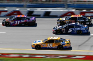 Drivers mix it up in Friday's NASCAR Sprint Cup Series practice session at Talladega Superspeedway.  Photo by Jerry Markland/Getty Images