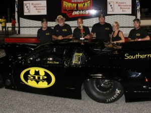 Bobby Daniel celebrates in victory lane after piloting his "Batmobile" to the Friday Night Drags Super Pro victory last week.  Photo by Tom Francisco/Speedpics.net