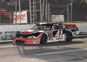 Brayton Haws crosses under the checkered flag to win the CARS Racing Tour Late Model Stock feature at Tri-County Motor Speedway Friday night.  Photo by Sherri Stearns