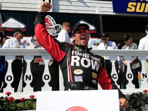 Martin Truex, Jr. celebrates after winning Sunday's NASCAR Sprint Cup Series race at Pocono Raceway.  Photo by Chris Trotman/Getty Images