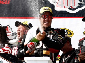 Martin Truex, Jr. sprays champagne in victory lane after winning Sunday's NASCAR Sprint Cup Series race at Pocono Raceway.  Photo by Jeff Zelevansky/NASCAR via Getty Images