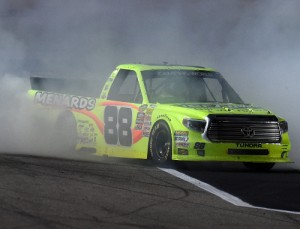 Matt Crafton celebrates with a burnout after winning Friday night's NASCAR Camping World Truck Series race at Texas Motor Speedway.  Photo by Rainier Ehrhardt/Getty Images for Texas Motor Speedway