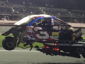Austin Dillon's destroyed Chevrolet is taken away on a rollback after a hard last lap crash in Sunday's NASCAR Sprint Cup Series race at Daytona International Speedway.  Dillon was able to walk away from the crash, which occurred as the pack took the checkered flag.  Photo by Sarah Marie Tonsmeire