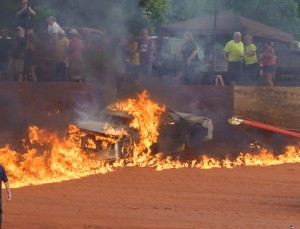 Bobby Arnold's car caught fire after a hard crash in the Bomber feature.  Arnold was able to extricate himself from the car, and was taken to an area hospital.  Photo by Francis Hauke/22fstops.com
