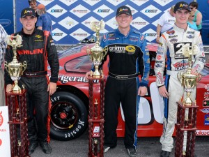 Eddie MacDonald (center) scored the win in Sunday's PASS Super Late Model Series race at New Hampshire Motor Speedway.  David Garbo, Jr. (left) finished in second, with Spencer Davis (right) in third.  Photo by Norm Marx