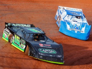 Jason Croft (16) scored the victory in Saturday's Super Late Model feature at Dixie Speedway.  Both he and T.J. Reaid (73) drove cars wrapped in represent the starring characters of the film "Champion", parts of which were filmed at the speedway Saturday night.  Photo by Kevin Prater/praterphoto.com