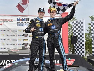 Ricky Taylor and Jordan Taylor celebrate their second TUDOR Prototype win of the season in victory lane at Canadian Tire Motorsports Park Sunday.  Photo by Scott R LePage LAT Photo USA